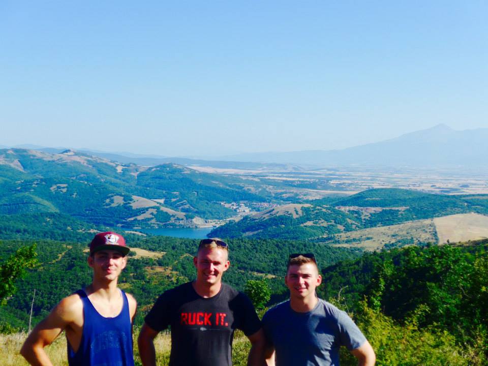 Puricelli (L) and two friends returning from 7-hour hike through mountains in Prishtina.